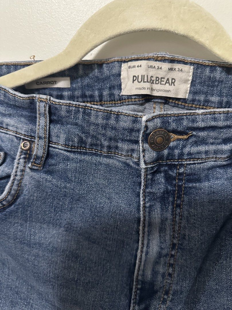Pull & Bear Carrot Fit Blue Denim Jeans (Category: Jeans) located in Mandaluyong City. Submitted by p_dcltrs (Listing ID 1458779764, Image 2). Description: - Brand: Pull & Bear - Fit: Carrot Fit - Wash: Classic Blue Denim - Size: EUR 44 / USA 34 / MEX 34 - Origin: Made in Bangladesh - Occasion: Ideal for casual wear - Condition: Please check photos for detailed condition..