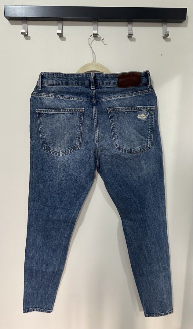 Pull&Bear Blue Distressed Denim Jeans (Category: Jeans) located in Mandaluyong City. Submitted by p_dcltrs (Listing ID 1458764099, Image 3). Description: - Brand: Pull&Bear - Color: Blue Denim - Fit: Straight Leg - Details: Distressed knees and thighs - Closure: Button and zip - Origin: Made in Turkey - Size: 32 Waist.