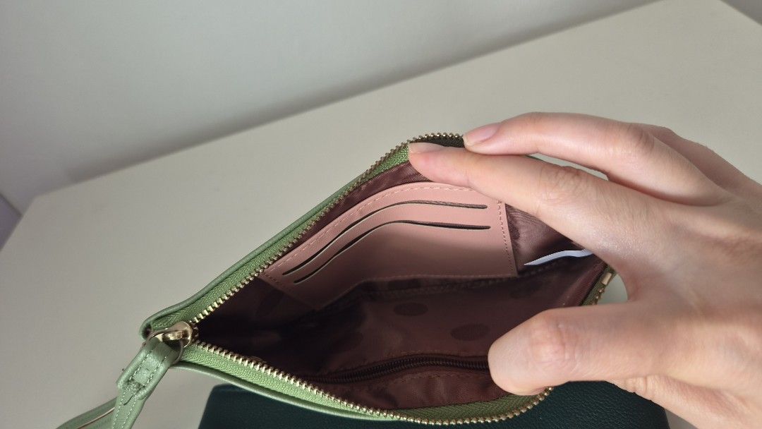 Purses (Category: Wallets & Card Holders) located in Singapore. Submitted by autumnpie (Listing ID 1458746544, Image 3). Description: only used the light green one for one overseas trip of about 3 days. dark green one not used at all. $5 each. internal compartments in third photo..