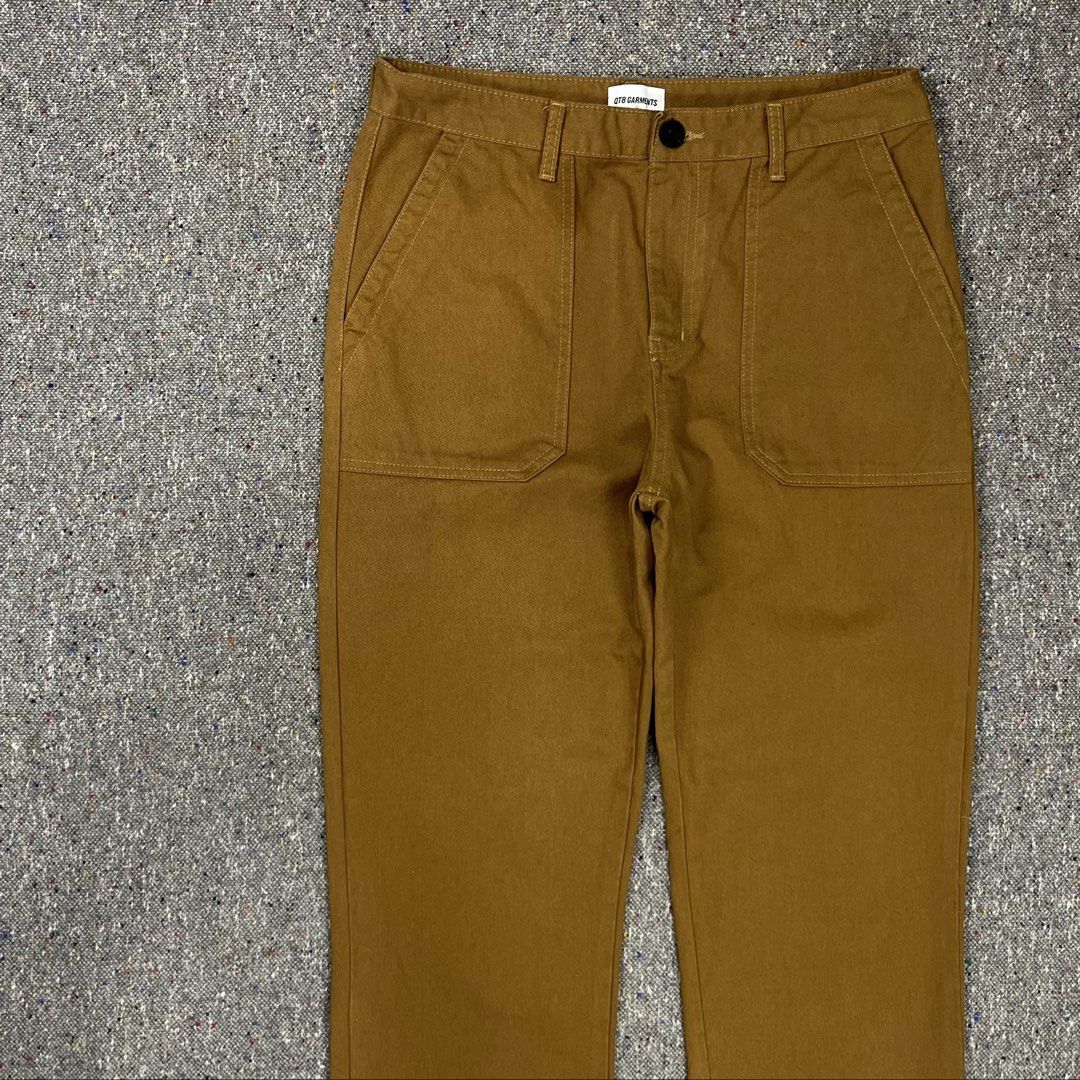 QT8 Garments Type 1 brown fatigue baker pants (Category: Trousers) located in Zamboanga. Submitted by deconstrukt.fit (Listing ID 1458875035, Image 2). Description: QT8 Garments Type 1 brown fatigue baker pants brown Fatigue Pants from the South Korean streetwear brand QT8 Garments feature a distinct military-inspired design with flat, square front patch pockets and a straight-leg silhouette. Size Medium 32 Waist (tagged) Dimension: 16” Waist 43”
