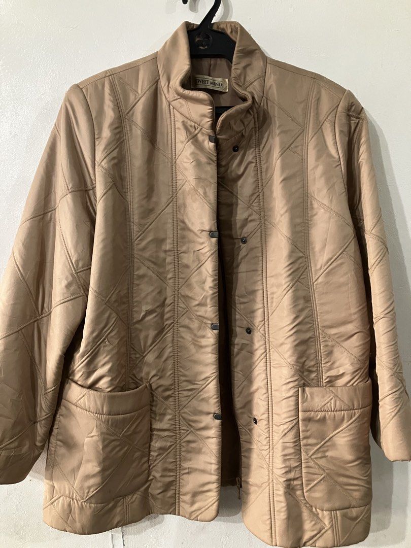 Quilted jacket/coat (Category: Coats, Jackets and Outerwear) located in Angeles City. Submitted by jnwsurplus (Listing ID 1458714926, Image 1). Description: beige quilted jacket featuring a stand-up collar and front pockets. .