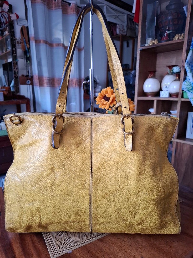 RABEANCO Yellow Leather Tote Bag (Category: Tote Bags) located in Libon. Submitted by jaladzarmi80045 (Listing ID 1458757363, Image 2). Description: - Genuine RABEANCO yellow leather tote bag - Spacious interior, ideal for everyday use - Two top handles with stylish buckle details - Signature metal logo plate on the front - Ample room for all your essentials.