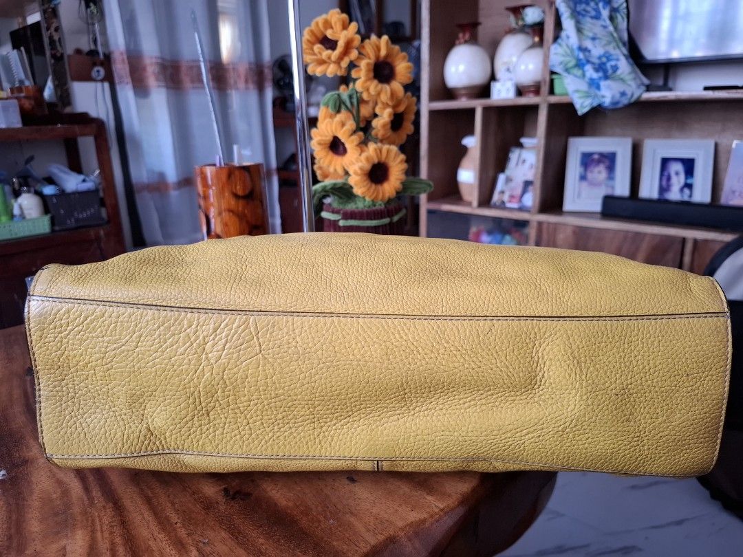 RABEANCO Yellow Leather Tote Bag (Category: Tote Bags) located in Libon. Submitted by jaladzarmi80045 (Listing ID 1458757363, Image 3). Description: - Genuine RABEANCO yellow leather tote bag - Spacious interior, ideal for everyday use - Two top handles with stylish buckle details - Signature metal logo plate on the front - Ample room for all your essentials.
