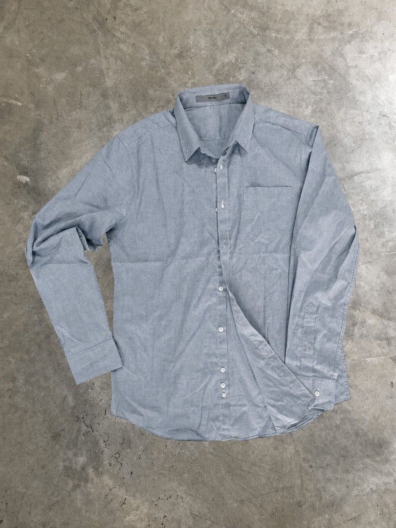 Rafael Classic Long-Sleeve Button-Up Shirt (Category: Coats, Jackets and Outerwear) located in Manila. Submitted by closetfiles.ph (Listing ID 1458719541, Image 1). Description: Rafael Classic Long-Sleeve Button-Up Shirt Brand: Rafael Color: Grayish Blue Code: CJ006 Size: - length: 28 in - width: 21 in Condition: 9/10.