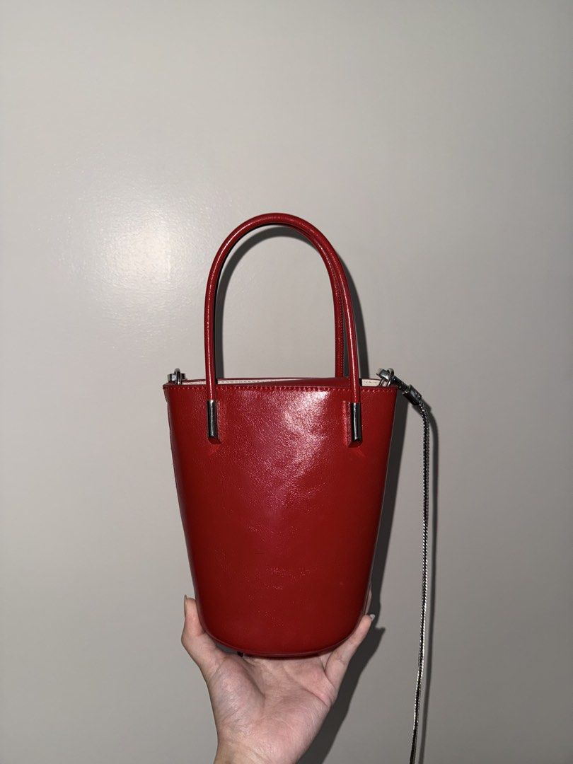 Red Leather Bucket Bag with Silver Chain Strap (Category: Cross-body Bags) located in Baguio. Submitted by p-finds (Listing ID 1458760622, Image 1). Description: - Cute red leather bucket bag - Back pocket - Silver chain strap - Top handles - Crossbody option - Clean interior.