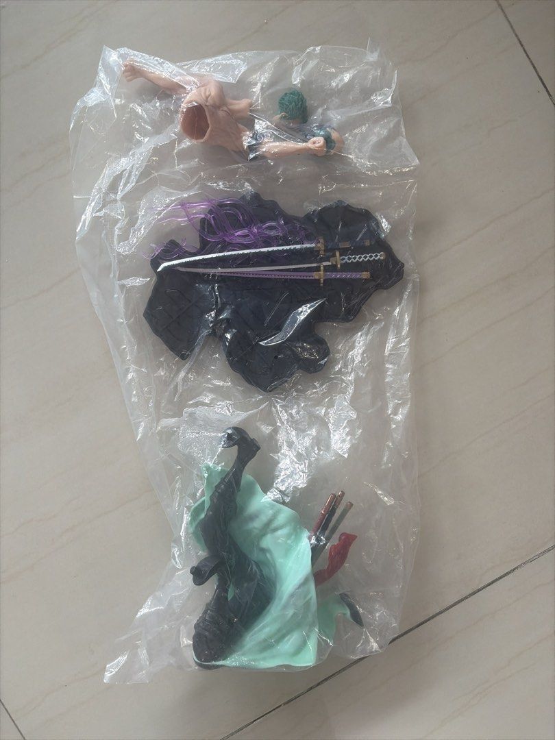 Roronoa Zoro Action Figure Statue (Category: Figurines & Statues) located in Mandaluyong City. Submitted by charliegirl1028 (Listing ID 1458767182, Image 3). Description: - Authentic Roronoa Zoro action figure from One Piece - Features the iconic Three-Sword Style - Unassembled and still sealed in bag - Highly detailed sculpt with intricate craftsmanship - Dynamic, action-ready pose - Comes complete with display base and accessories - A must-have