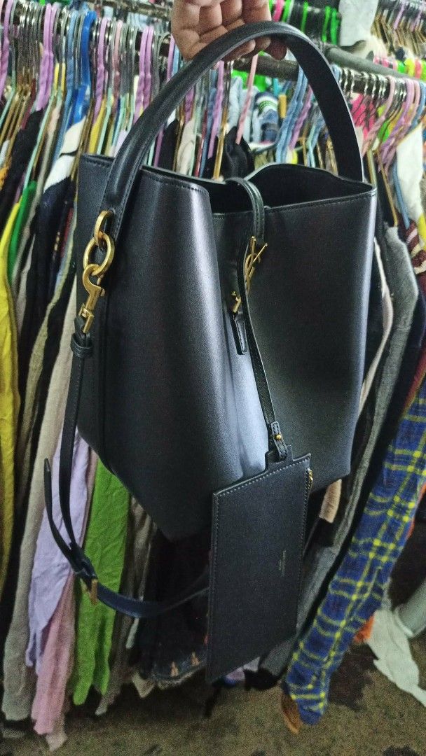 Saint Laurent Black Leather Hobo Bag with Pouch (Category: Luxury Bags & Wallets) located in Baguio. Submitted by XycerlynCLXN (Listing ID 1458802007, Image 2). Description: - Authentic Saint Laurent black leather hobo bag - Comes with a matching card holder pouch - Elegant gold hardware details - Expertly crafted in Italy - Clean interior, ready for your essentials - Ideal for everyday style and practicality.