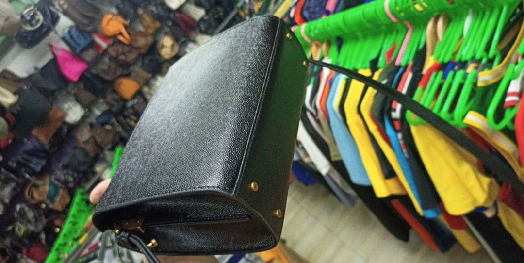 Saint Laurent Black Leather Monogram Small Satchel Bag (Category: Luxury Bags & Wallets) located in Baguio. Submitted by XycerlynCLXN (Listing ID 1458804080, Image 2). Description: - black leather YSL satchel bag - Elegant gold YSL logo hardware - Versatile top handle and detachable shoulder strap - Multiple interior compartments for organization - Immaculate condition, inside and out - Ideal for both everyday wear and special events.