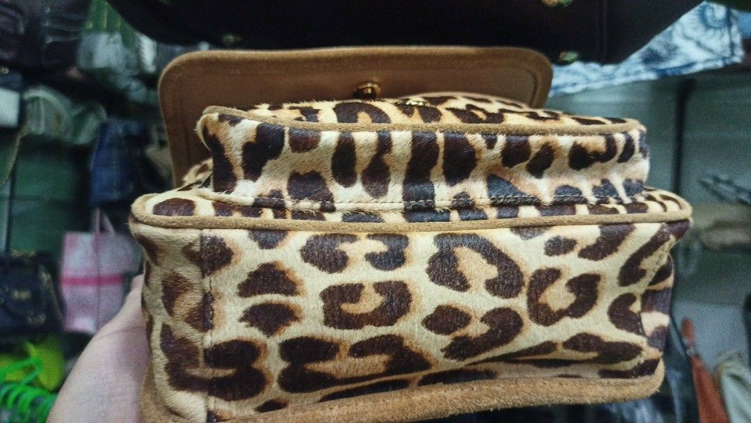 Saint Laurent Leopard Print Suede Chain Shoulder Bag (Category: Luxury Bags & Wallets) located in Baguio. Submitted by XycerlynCLXN (Listing ID 1458801779, Image 2). Description: - Eye-catching leopard print shoulder bag - Luxurious suede trim - Elegant gold chain strap - Iconic YSL logo on the front flap - Interior: Main compartment + smaller pocket - Versatile: Perfect for statement outfits, nights out, or everyday chic.