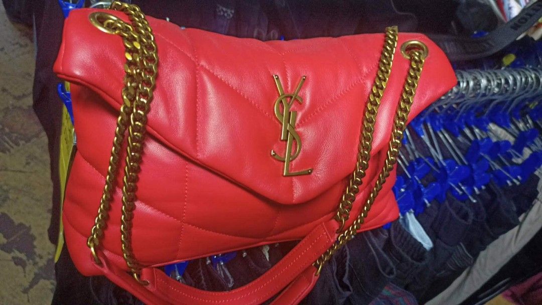 Saint Laurent Red Leather YSL Monogram Chain Bag (Category: Luxury Bags & Wallets) located in Baguio. Submitted by XycerlynCLXN (Listing ID 1458799325, Image 1). Description: - preloved red leather YSL bag - Elegant gold chain strap - Classic quilted chevron pattern (front and back) - Iconic YSL logo on the flap - Interior zip pocket for essentials - Luxurious gold hardware throughout - Versatile for day or night use.