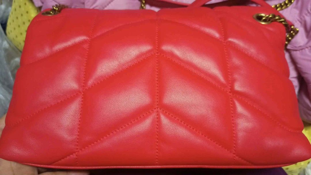 Saint Laurent Red Leather YSL Monogram Chain Bag (Category: Luxury Bags & Wallets) located in Baguio. Submitted by XycerlynCLXN (Listing ID 1458799325, Image 2). Description: - preloved red leather YSL bag - Elegant gold chain strap - Classic quilted chevron pattern (front and back) - Iconic YSL logo on the flap - Interior zip pocket for essentials - Luxurious gold hardware throughout - Versatile for day or night use.