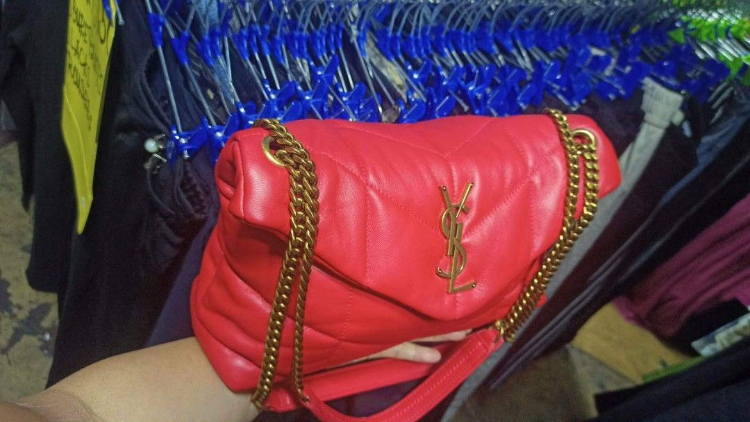 Saint Laurent Red Leather YSL Monogram Chain Bag (Category: Luxury Bags & Wallets) located in Baguio. Submitted by XycerlynCLXN (Listing ID 1458799325, Image 3). Description: - preloved red leather YSL bag - Elegant gold chain strap - Classic quilted chevron pattern (front and back) - Iconic YSL logo on the flap - Interior zip pocket for essentials - Luxurious gold hardware throughout - Versatile for day or night use.