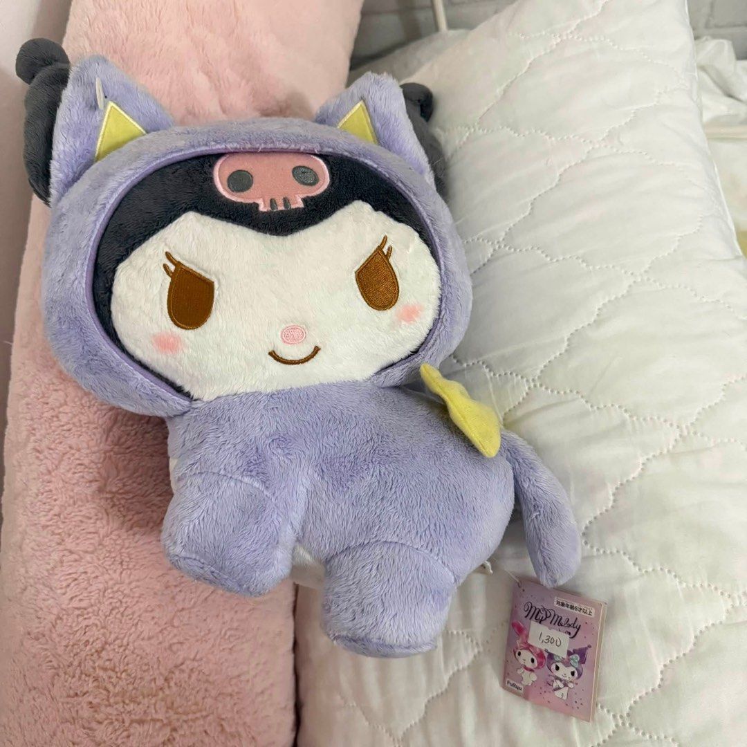 Sanrio Cat Neko Kuromi Plush (Category: Plushies & Soft Toys) located in Makati City. Submitted by yumiiichigo (Listing ID 1458866169, Image 1). Description: - Adorable Kuromi plush toy - Features a cool purple hoodie with a skull design - Incredibly soft and cuddly material - A must-have for any Sanrio fan! - Brand new with original tag attached.