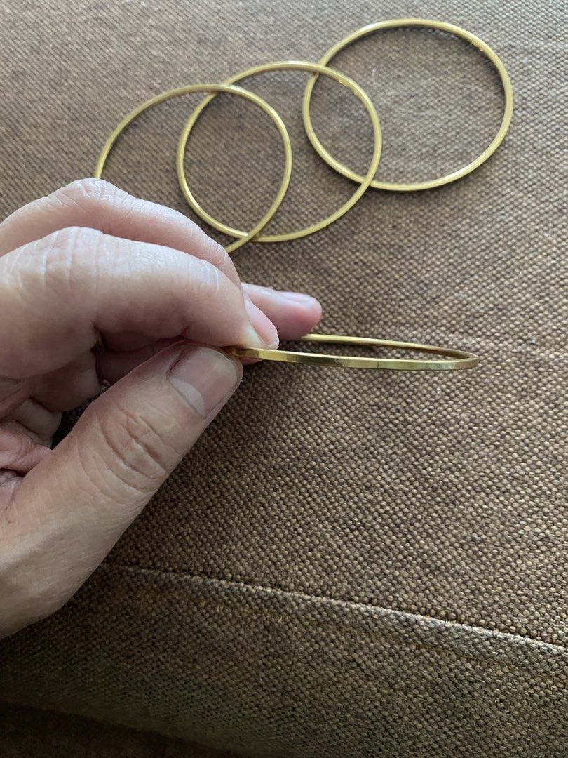 Set of 4 Gold Tone Thin Bangles (Category: Bracelets) located in Makati City. Submitted by dpjanssen (Listing ID 1458711460, Image 2). Description: - Set of 4 thin bangles - Simple and classic design - Gold tone finish - Perfect for stacking or wearing individually - Lightweight and comfortable for all-day wear - A versatile accessory to complement any outfit.