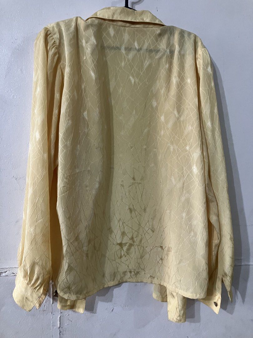 Sheer long sleeves button up blouse (Category: Blouses) located in Angeles City. Submitted by jnwsurplus (Listing ID 1458718056, Image 2). Description: light yellow, sheer long-sleeve button-up blouse with a subtle textured pattern and front pocket details..