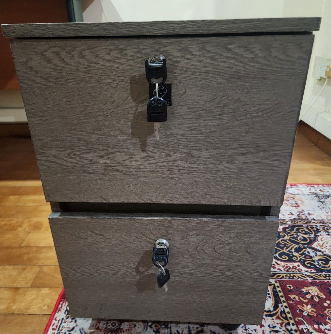 Side table (Category: Tables & Sets) located in Singapore. Submitted by inc3083489 (Listing ID 1458783780, Image 2). Description: Drawer with lock Comes as a set of 2 Wheels not working One for 20 , two for 25.