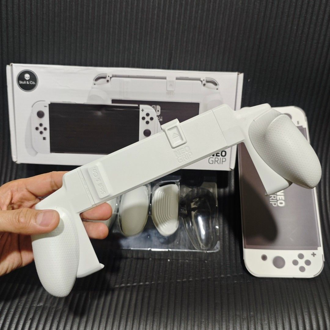 Skull & Co Neo Grip White for Nintendo Switch Oled (Category: Cases & Covers) located in Quezon City. Submitted by shopme_gadget30 (Listing ID 1458843423, Image 2). Description: kindly read the details first for sale fixed price mint Condition skull & co neo grip white with 2 extra pair of grip holder compatible to Nintendo switch oled below srp Shoopppppeee —,✅ can check out pm for the linnnkkk (If shoopppee check out, price is higher because of