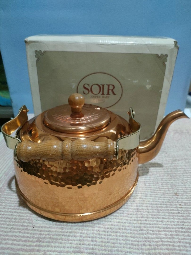 SOIR Copper Ware Hammered Kettle with Wooden Handle (Category: Coffee & Tea Tableware) located in Bulacan. Submitted by hunterherojapanjdm (Listing ID 1458796237, Image 1). Description: - Vintage SOIR copper kettle - Hammered texture all over the body - Wooden handle and lid knob for comfortable grip - Comes with original box - Great for display or use - Classic kitchen piece.