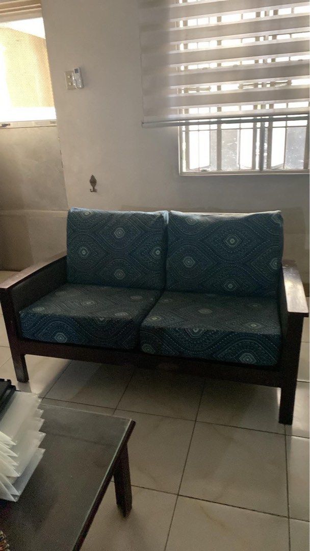 Solid Mahogany Wooden Sofa Set with Teal Cushions and center table (Category: Sofas) located in Muntinlupa City. Submitted by ashley.18 (Listing ID 1458746253, Image 2). Description: - Dark wood sofa set - Includes: 1x three-seater sofa, 1x two-seater armchair - Cushions feature a teal geometric pattern - Ideal for living room spaces - Coffee table available separately.