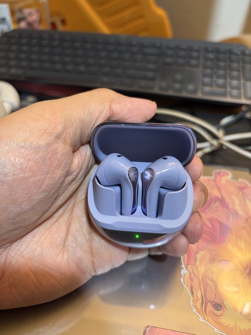 SOUNDPEATS Wireless Earbuds with Charging Case (Category: Earphones) located in Manila. Submitted by smmcruz (Listing ID 1458862083, Image 2). Description: - SOUNDPEATS wireless earbuds - Light purple color - Round charging case (purple with silver top) - Green indicator light for charging/power - Ideal for music and calls on the go.
