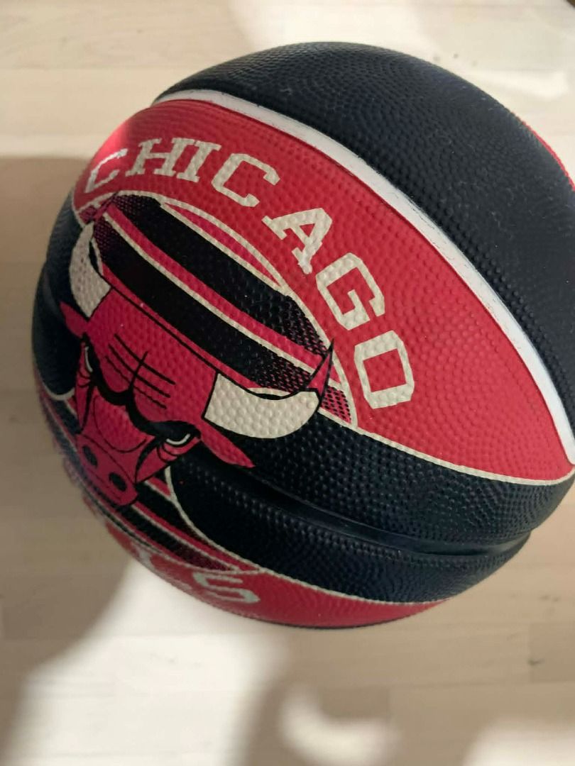 Spalding Chicago Bulls Basketball (Category: Racket and Ball Sports) located in Manila. Submitted by musedeclutters (Listing ID 1458748582, Image 1). Description: Spalding Chicago Bulls basketball. Black and red with bull head logo. Good grip for playing or collecting..
