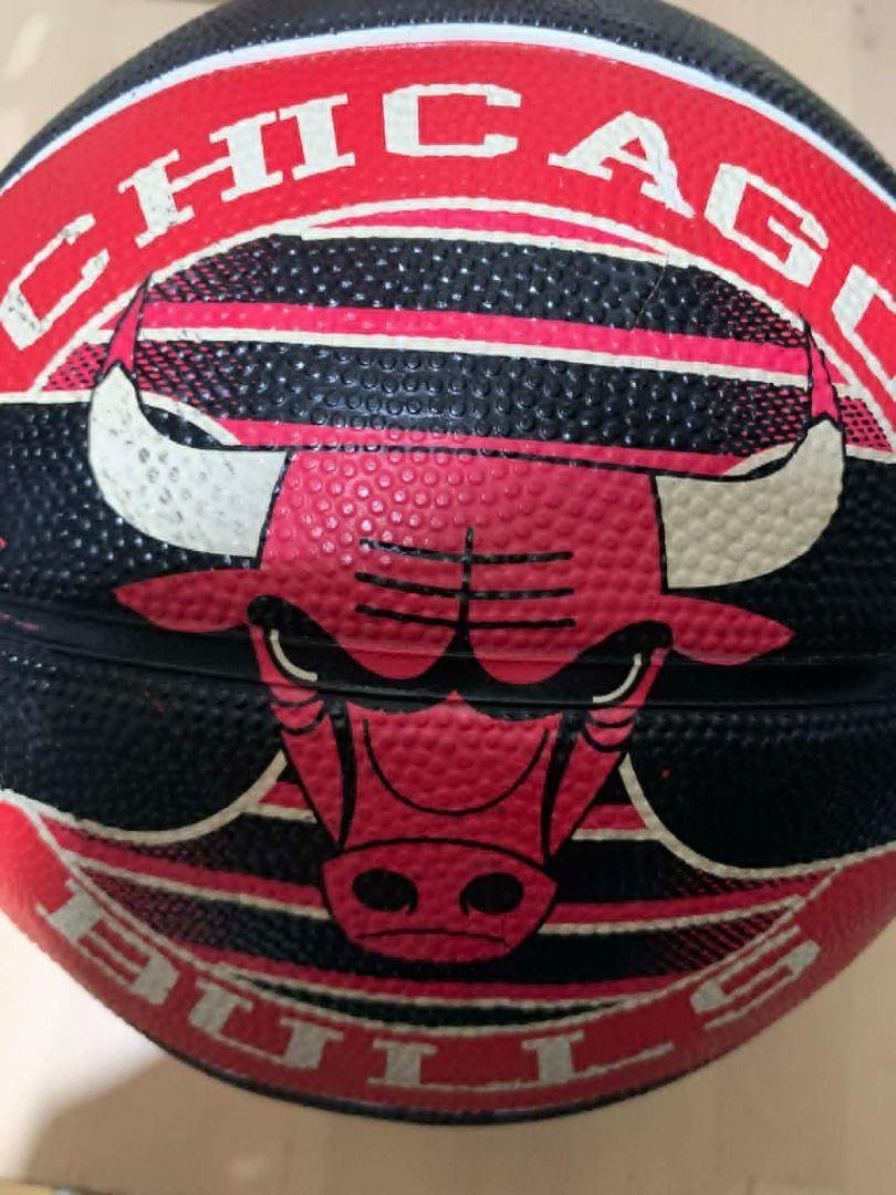 Spalding Chicago Bulls Basketball (Category: Racket and Ball Sports) located in Manila. Submitted by musedeclutters (Listing ID 1458748582, Image 2). Description: Spalding Chicago Bulls basketball. Black and red with bull head logo. Good grip for playing or collecting..