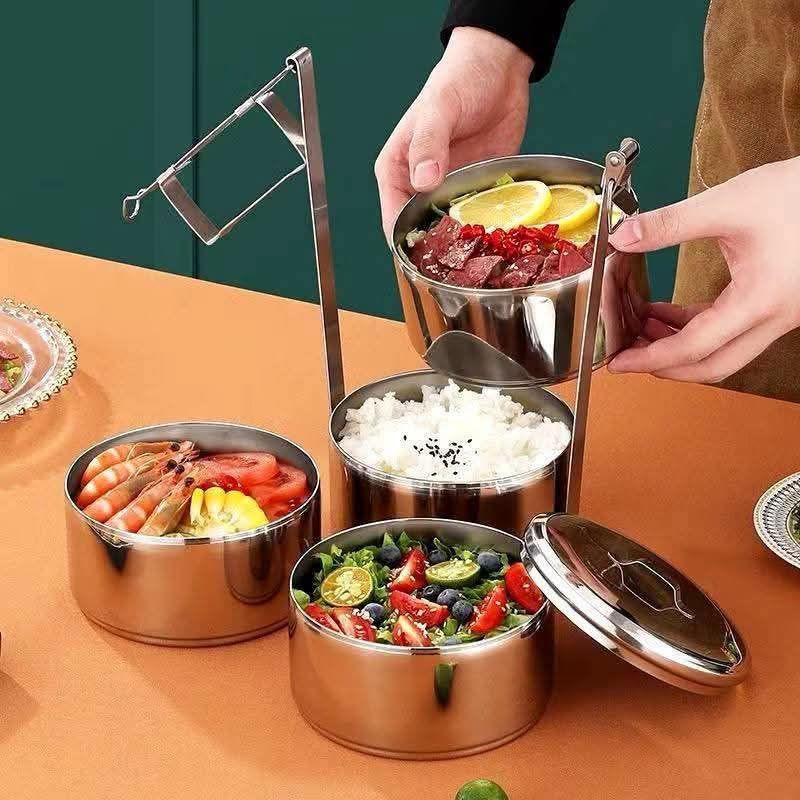 Stainless Steel Stackable Lunch Box Tiered Food Container (Category: Food Organization & Storage) located in Manila. Submitted by iliasjen3082126 (Listing ID 1458779439, Image 3). Description: - Stackable stainless steel lunch box - Ideal for school or office lunches - Each tier is a separate container - Features a convenient top handle fo easy carrying - Durable and easy to clean - Keeps food fresh and prevents mixing - Multiple tiers allow for 