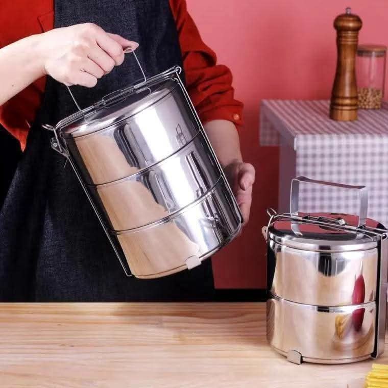Stainless Steel Stackable Lunch Box Tiered Food Container (Category: Food Organization & Storage) located in Manila. Submitted by iliasjen3082126 (Listing ID 1458779439, Image 2). Description: - Stackable stainless steel lunch box - Ideal for school or office lunches - Each tier is a separate container - Features a convenient top handle fo easy carrying - Durable and easy to clean - Keeps food fresh and prevents mixing - Multiple tiers allow for 