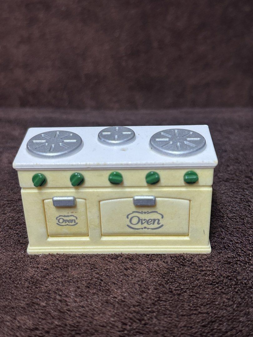 Sylvanian Families Oven (Category: Kids Toys) located in Manila. Submitted by aly_tan0903 (Listing ID 1458741264, Image 1). Description: - Toy oven and stove set for pretend play - Features 3 burners on top - Includes 2 oven doors at the front - Comes with green knobs - Oven doors are labeled 'Oven' - Ideal for imaginative and creative play.
