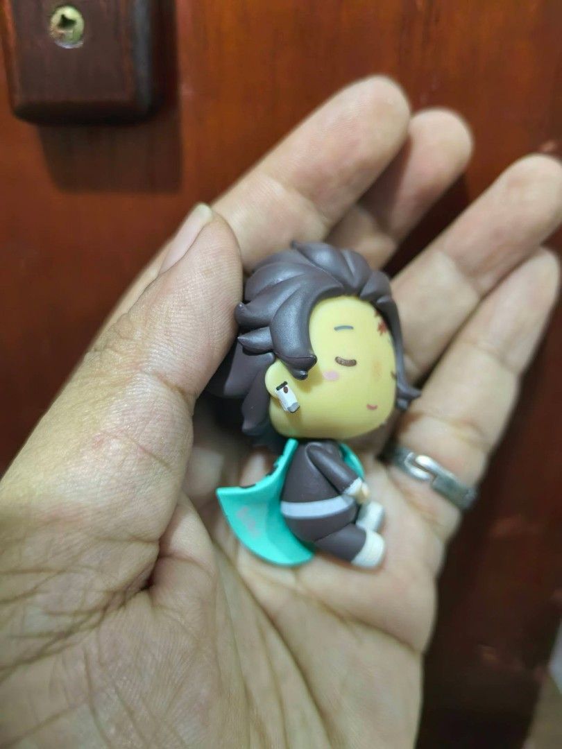 Tanjiro Kamado Chokonokko Mini Figure (Category: Figurines & Statues) located in Cebu City. Submitted by dudes_villanueva (Listing ID 1458696594, Image 3). Description: Figure - Tanjiro Kamado Chokonokko Mini Figure No Markings 📌 From the anime Demon Slayer: Kimetsu no Yaiba. 📌 Character: Tanjiro Kamado in a cute chibi style. 📌 Design: He has a calm, smiling expression with rosy cheeks and wears his checkered uniform with a turquoise accent. �