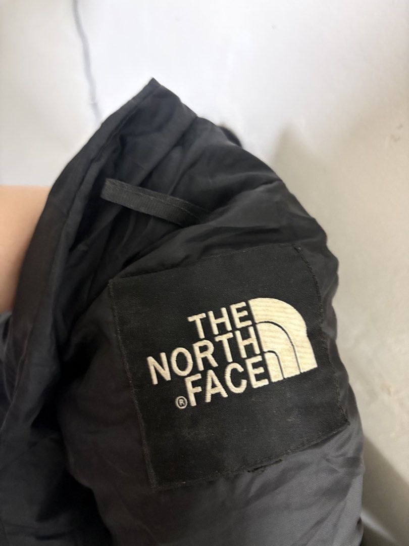 The North Face Black Puffer Jacket (Category: Coats, Jackets and Outerwear) located in General Trias. Submitted by crissy9053136 (Listing ID 1458816792, Image 3). Description: - Classic black puffer jacket from The North Face - Embroidered logo on chest and inner tag - Full zip closure - Features pockets - Excellent for staying warm - Stylish design.