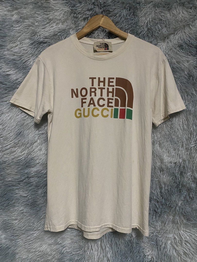 THE NORTH FACE X GUCCI (Category: Tshirts & Polo Shirts ) located in Cavite. Submitted by lwrnc.444 (Listing ID 1458866199, Image 1). Description: THE NORTH FACE X GUCCI SHIRT NO WASHTAG GOOD CONDITION DIMES WIDTH 19 LENGTH 27.5-28 🏷️349+SHIPPING FEE DASMARIÑAS CAVITE LOC .