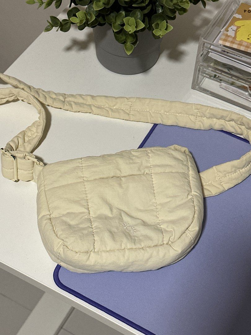 The Paper Bunny Mini Puffer Swing - Cream (Category: Cross-body Bags) located in Pasig City. Submitted by tinqsalazar (Listing ID 1458808442, Image 1). Description: - Authentic The Paper Bunny Mini Puffer Swing - Classic cream / ivory color; super versatile and easy to style - Lightweight, soft & puffy quilted design - Adjustable padded strap for comfortable crossbody wear - Overall in good condition; clean and well-kept - Flaw on the strap buckl