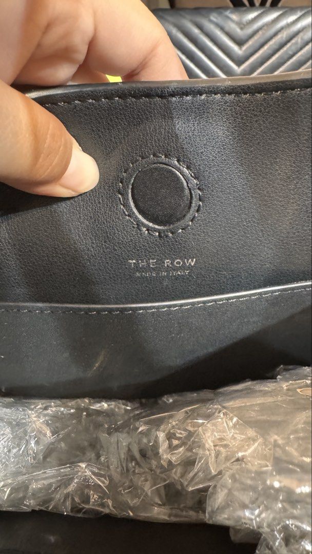 The Row Symmetric Leather Shoulder Bag (Category: Luxury Bags & Wallets) located in Rodriguez. Submitted by PrelovedbyMelz (Listing ID 1458710019, Image 3). Description: The Row bag - Made in Italy - Genuine leather - Spacious interior with pockets - Classic design - Great for everyday use.