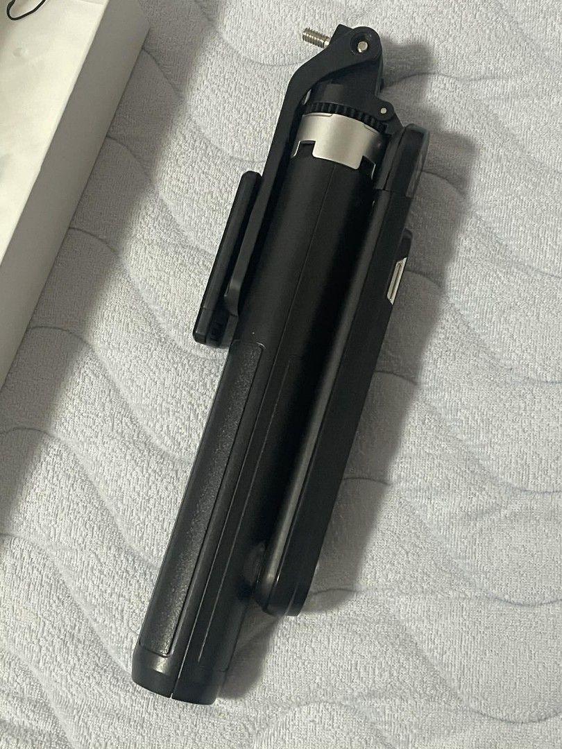 TNW S25 Selfie Stick Tripod (Category: Tripods & Monopods) located in Rizal. Submitted by magi_declutters (Listing ID 1451904664, Image 3). Description: TNW S25 Selfie Stick/Tripod - 400 (negotiable) - Bought for 580 - Used but not abused - Can connect to Android and IOS Inclusions: - Tripod, bluetooth remote, bag, manual, & box - No charger (Type C).