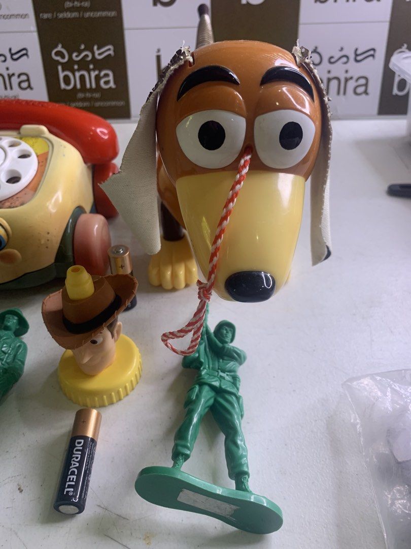Toy Story - Slinky Dog - Set (Category: Vintage Collectibles) located in Carmona. Submitted by bihira (Listing ID 1458819980, Image 3). Description: Toy Story - Slinky Dog - Set - WYSIWYG - As is condition - slinky’s leather ears have cracks - Authentic Slinky Dog / Movie Accurate Size - Authentic buzz and woody - Green Toy Soldiers - Dial Phone.