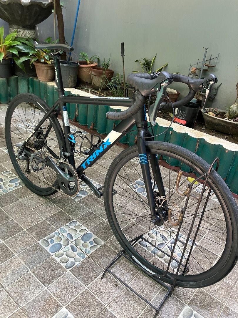 TRINX climber 1.1 Bike (Category: Bicycles) located in Pasig City. Submitted by oznerolorenzo (Listing ID 1458786271, Image 1). Description: Price: 9,000 pesos. Price is negotiable. Condition: Well Used Reason for selling: Need Space, Decluttering, Di na ginagamit, etc. Location: Santa Lucia, Pasig City ISSUES: front derailleur not working properly - Trinx climber 1.1 size 50cm alloy frameset (may bike skin sa frame) - Groupset : Shimano Claris r