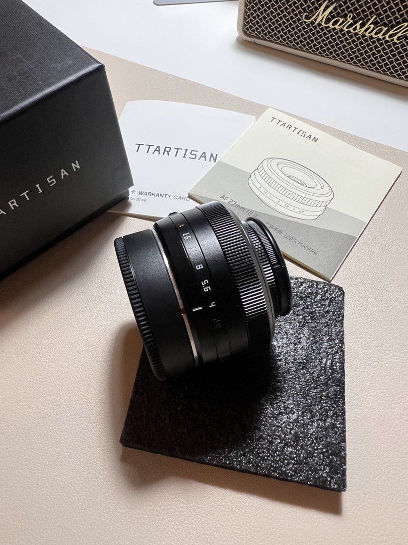 TTARTISAN AF 27mm F2.8 Lens (Category: Lens & Kits) located in Las Pinas. Submitted by csco.mnl (Listing ID 1458776469, Image 3). Description: TTArtisan AF 27mm f/2.8 Pancake Lens for Fujifilm X-Mount Bought last year. Compact and lightweight, perfect for everyday, travel, and street photography. ✨ Good condition, good as new. 📦 Comes with original box, lens caps, and manual. Price: ₱4,500.00 Message me if interested! 🙂.