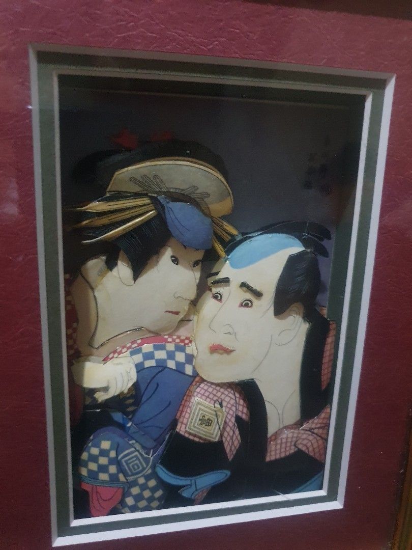 ukiyo-e Kabuki Art wall decor (Category: Frames & Pictures) located in Quezon City. Submitted by collectionneursonline88 (Listing ID 1458874648, Image 3). Description: - Authentic Japanese woodblock print artwork - Depicts two figures in traditional Japanese clothing - Elegant gold and black decorative frame - Rich maroon matting for a classic look - Wooden backing with Japanese text and hanging cord - A unique and eye-catching piece for your hom