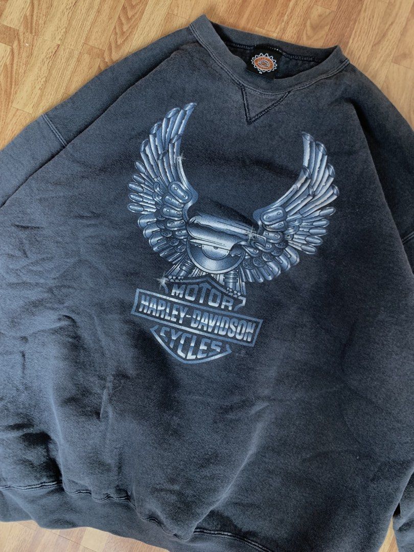 Vintage 1996 Harley-Davidson Eagle Graphic Sweatshirt (Category: Coats, Jackets and Outerwear) located in Cebu City. Submitted by zen.lasonking (Listing ID 1458837107, Image 2). Description: Classic Harley-Davidson sweatshirt. Features the iconic eagle graphic on the front. Copyright 1996. Great for any fan. Has a small Harley logo on the sleeve too. Crewneck style..