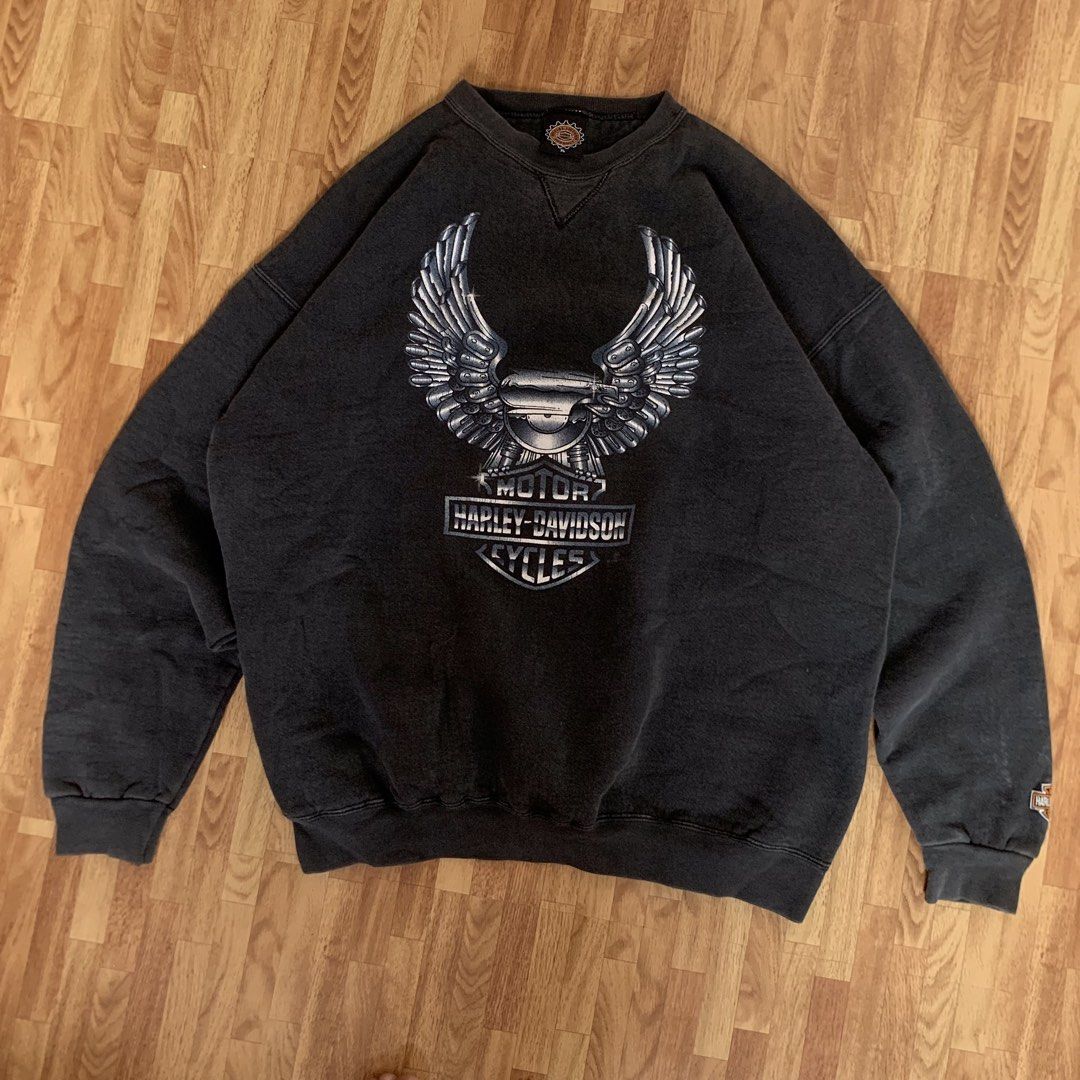 Vintage 1996 Harley-Davidson Eagle Graphic Sweatshirt (Category: Coats, Jackets and Outerwear) located in Cebu City. Submitted by zen.lasonking (Listing ID 1458837107, Image 1). Description: Classic Harley-Davidson sweatshirt. Features the iconic eagle graphic on the front. Copyright 1996. Great for any fan. Has a small Harley logo on the sleeve too. Crewneck style..