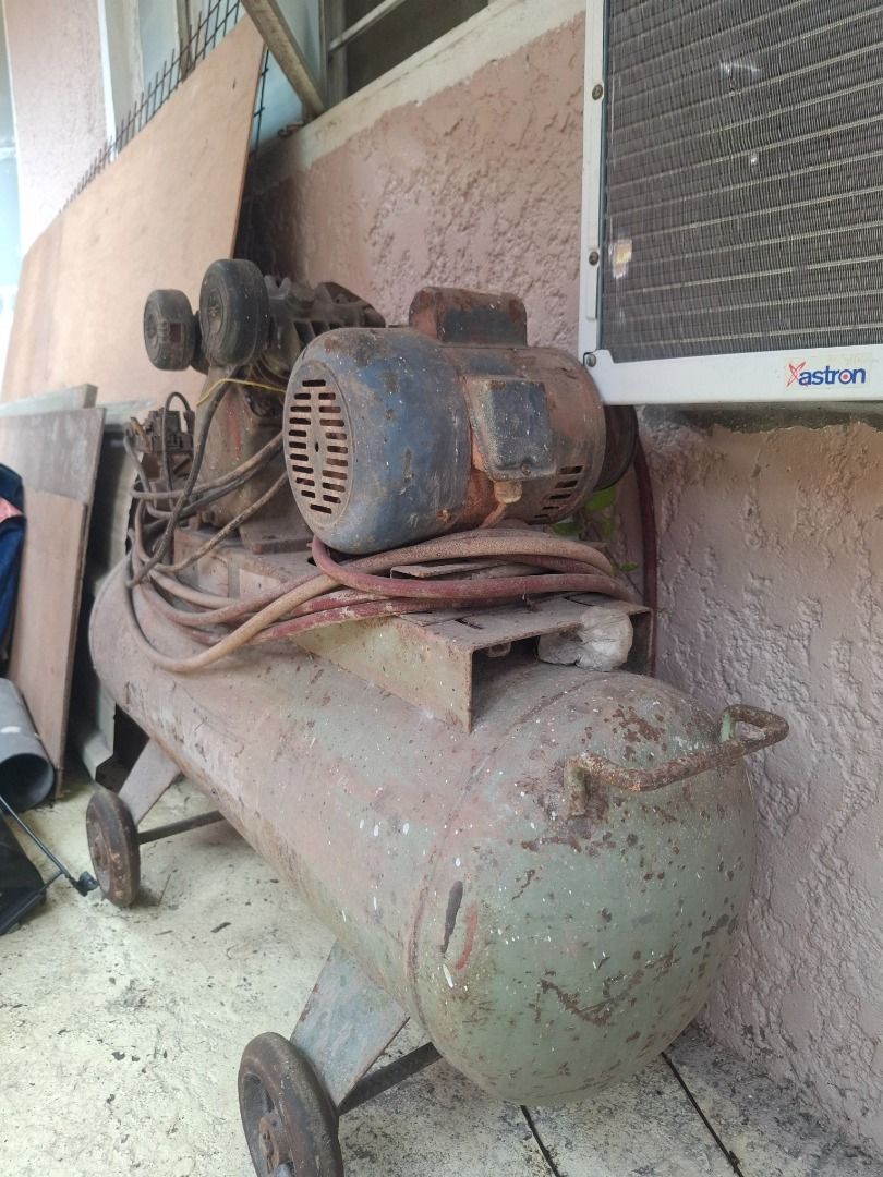 Vintage Air Compressor with Motor (Category: Construction Tools & Equipment) located in Caloocan City. Submitted by nathan_velasco (Listing ID 1458703400, Image 1). Description: - Old school air compressor - Motor still attached - Equipped with wheels for portability - Ideal for DIY projects or spare parts - Sold as is.