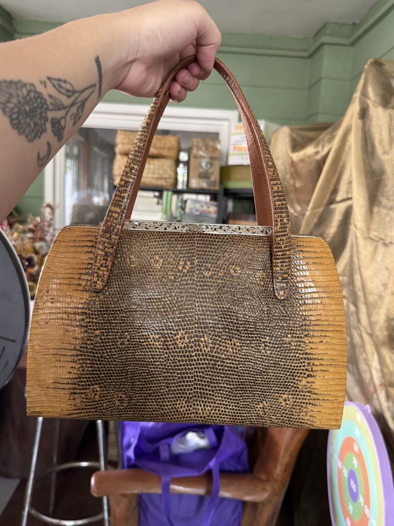 Vintage Brown Lizard Skin Handbag (Category: Purses & Pouches) located in Bacoor. Submitted by nicafindssince2022 (Listing ID 1458689811, Image 3). Description: - Cute vintage handbag - Brown lizard skin texture - Clasp closure - Top handles for carrying - Perfect for a retro vibe - Approx. 10 inches wide - Approx. 6 inches tall.