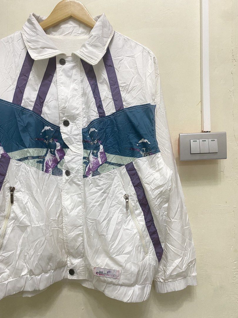 vintage white Ellesse nylon windbreaker (Category: Coats, Jackets and Outerwear) located in Inodaran. Submitted by sai_thriftdrift (Listing ID 1458768393, Image 2). Description: Width : 24 Length : 26 Condition : 10/10 Color rate : 10/10 Issue none flawless.