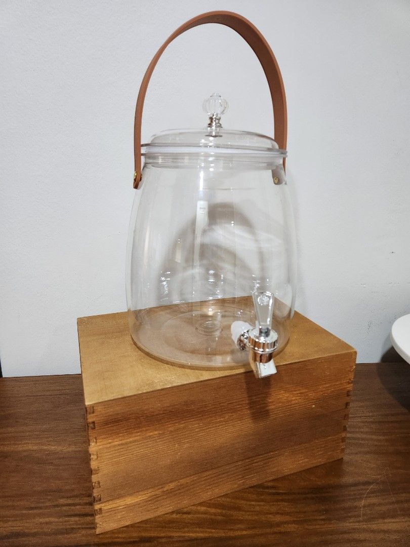 Water Juice Beverage Dispenser Jar (Category: Pitchers & Dispensers) located in Pasig City. Submitted by nicspicksss (Listing ID 1458716613, Image 3). Description: P693 sale price in orange app Selling for P450 - clear acrylic drink dispenser - true to size. can fit about 5 x 1L soda bottle + ice - Sturdy leather looking plastic strap or handle for carrying - easy assembly and easy to wash too - Ideal for cute party set up, events, and gatherings