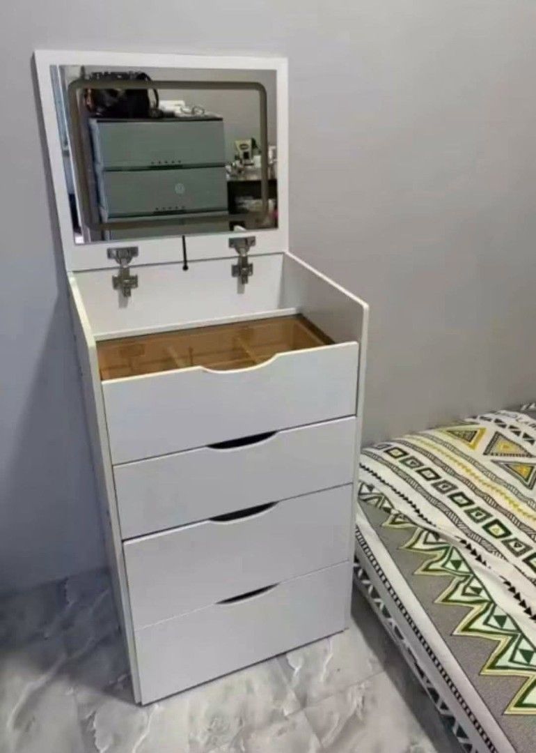 White LED Vanity Table with Mirror and Storage (Category: Tables & Sets) located in Mandaluyong City. Submitted by carmy.94 (Listing ID 1458884439, Image 3). Description: - Stylish white dressing table with integrated LED mirror - Multiple drawers for generous storage - Top compartment with dividers for makeup organization - Crafted from durable ecological board - Compact dimensions: 60cm (L) x 40cm (W) x 80cm (H) - Comes with a matching stool.