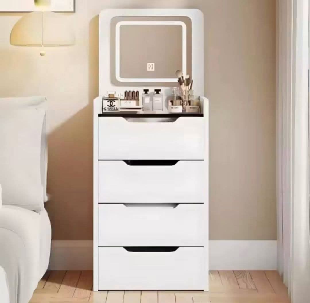White LED Vanity Table with Mirror and Storage (Category: Tables & Sets) located in Mandaluyong City. Submitted by carmy.94 (Listing ID 1458884439, Image 1). Description: - Stylish white dressing table with integrated LED mirror - Multiple drawers for generous storage - Top compartment with dividers for makeup organization - Crafted from durable ecological board - Compact dimensions: 60cm (L) x 40cm (W) x 80cm (H) - Comes with a matching stool.