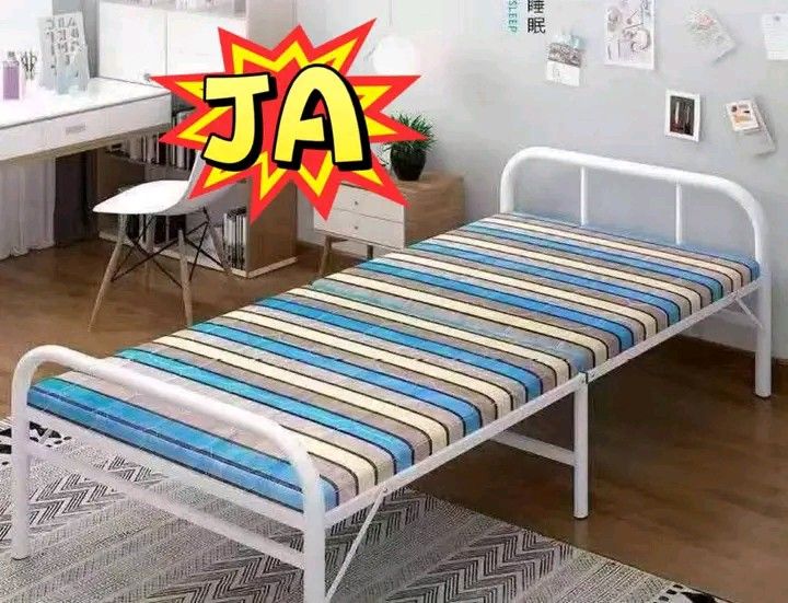 White Metal Folding Bed with Mattress (Category: Bed Frames & Mattresses) located in Manila. Submitted by berdenmarl01688 (Listing ID 1458876134, Image 1). Description: - White metal folding bed - Includes comfortable striped mattress - Folds up for easy storage - Ideal for guests or maximizing small spaces - Sturdy and reliable frame.