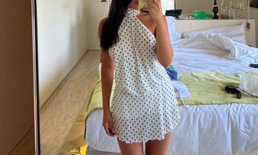 White polka dot halter neck mini dress (Category: Dresses) located in Paranaque City. Submitted by beautyandluxbycaitlyn (Listing ID 1458746363, Image 1). Description: - Super cute white dress with black polka dots - Halter neck style - Mini length - Lettuce hem detail - Ideal for vacations or nights out - Easy to wear and style.