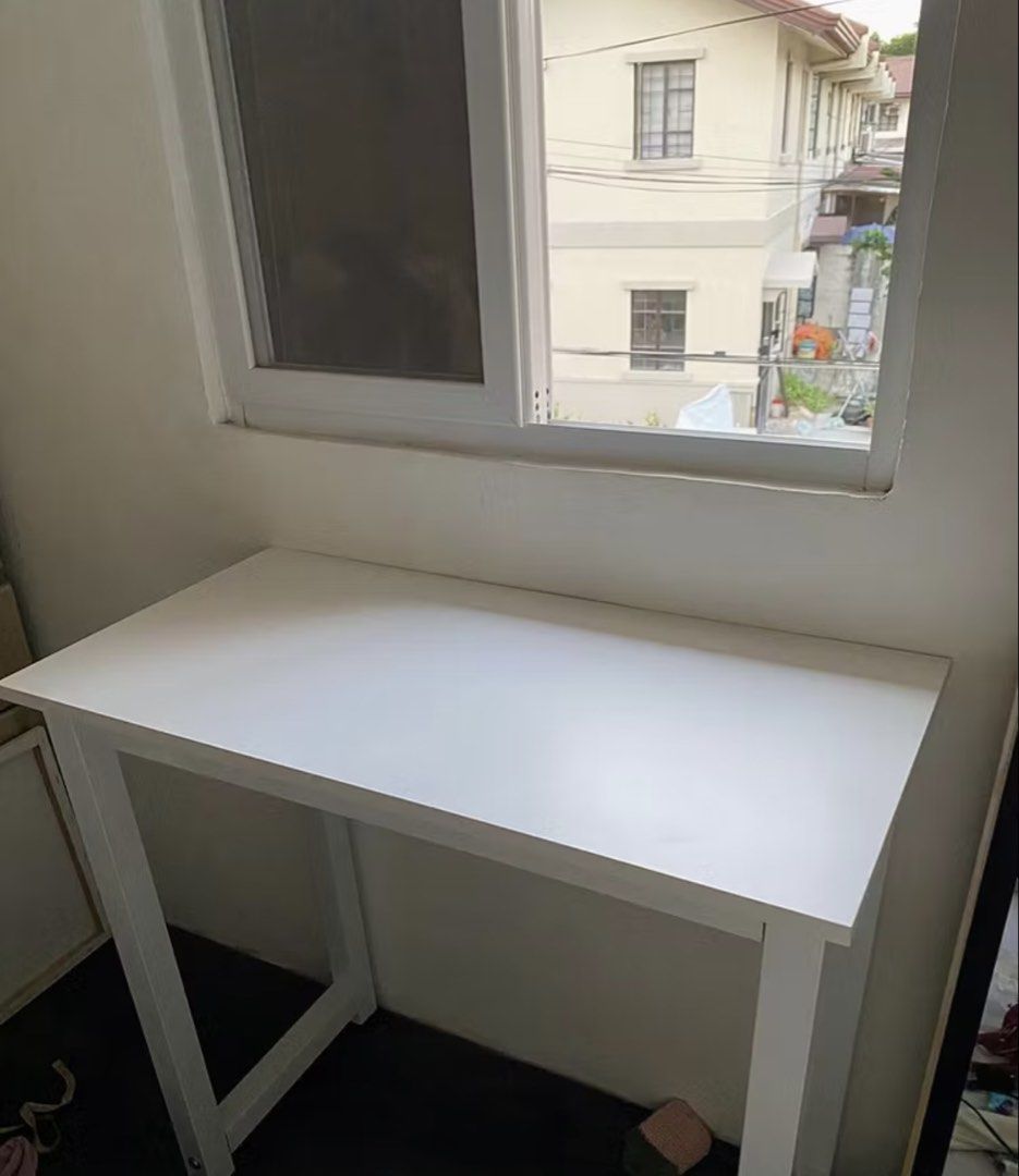 White Study Desk / Computer Table 80x40x74cm (Category: Tables & Sets) located in Rizal. Submitted by declutteryarn (Listing ID 1458869189, Image 2). Description: - Simple white desk, perfect for studying or working from home. - Dimensions: 80cm (W) x 40cm (L) x 74cm (H). - Easy to assemble and very sturdy. - Ideal for small spaces. - Selling because I upgraded to a new desk. - With minimal scratches on foot but doesn't affect performance bought 